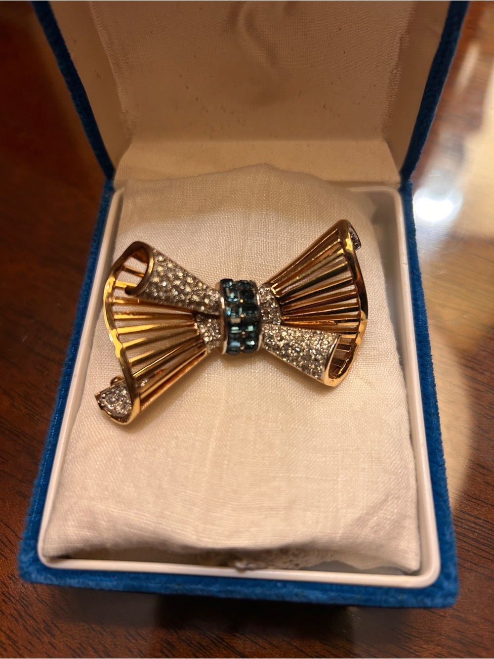 Vintage D’Orlan Gold Bow Brooch with Blue Crystal Center